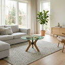 Runder Couchtisch mit Schmetterlingsbeinen aus Massivholz